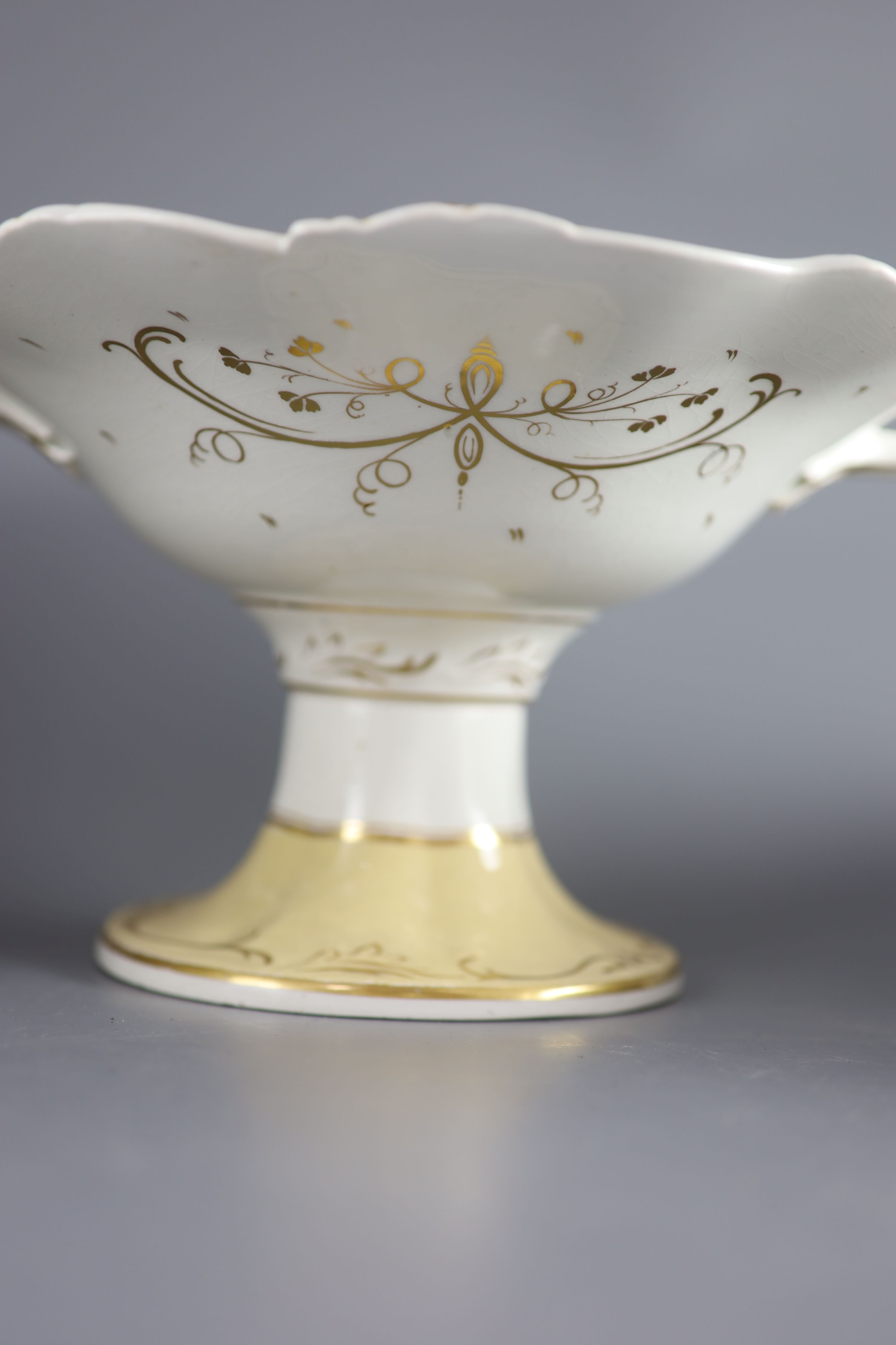 A Staffordshire cream and gilt twenty one piece part dessert service,